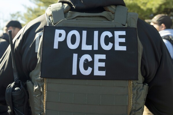 A U.S. Immigration and Customs Enforcement officer listens during a briefing, Jan. 27, 2025, in Silver Spring, Md. (AP Photo/Alex Brandon, File)