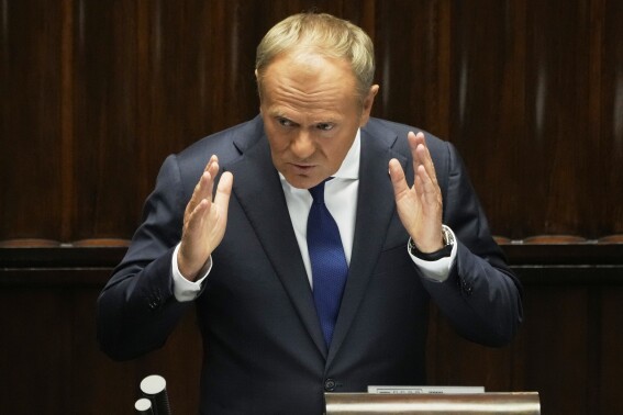 Poland's Prime Minister Donald Tusk addresses the Polish parliament on Wednesday, June 11, 2025, in Warsaw, Poland. (AP Photo/Czarek Sokolowski)