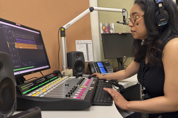 Elayna Cunningham, a college student interning at Koahnic Broadcast Corp., records a program on July 10, 2025, at the Anchorage, Alaska, studios of KNBA, the flagship station for National Native News. (AP Photo/Mark Thiessen)