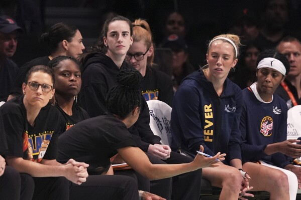 Indiana Fever's Caitlin Clark watches during the first half of a WNBA basketball game against the New York Liberty Wednesday, July 16, 2025, in New York. (AP Photo/Frank Franklin II)