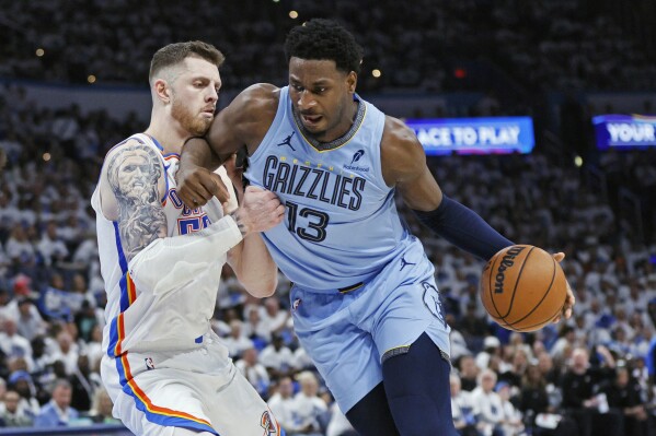 Memphis Grizzlies forward Jaren Jackson Jr. (13) drives against Oklahoma City Thunder center Isaiah Hartenstein, left, during the second half in Game 1 of an NBA first-round playoff series, April 20, 2025, in Oklahoma City. (AP Photo/Nate Billings, File)
