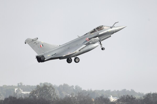 A French-made Rafale fighter jet takes off on the inaugural day of the Aero India 2021 at Yelahanka air base in Bengaluru, India, Wednesday, Feb. 3, 2021. (AP Photo/Aijaz Rahi, File)