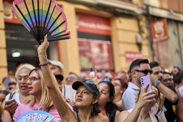 People take part in festivities and preparations ahead of the annual high heel race during Madrid's Pride week in Madrid, Thursday, July 3, 2025. (AP Photo/Manu Fernandez)