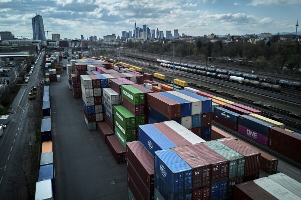 Containers are piled up at a cargo terminal in Frankfurt, Germany, April 1, 2025. (AP Photo/Michael Probst, File)