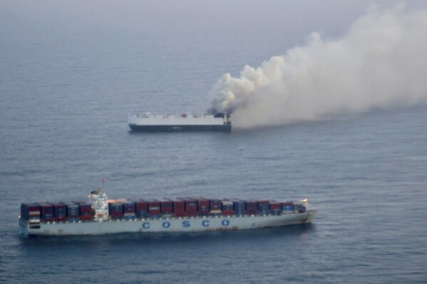 In this photo provided by the U.S. Coast Guard, smoke rises from cargo vessel Morning Midas approximately 300 miles south of Adak, Alaska, June 3, 2025. (U.S. Coast Guard/Courtesy of Air Station Kodiak via AP, File)