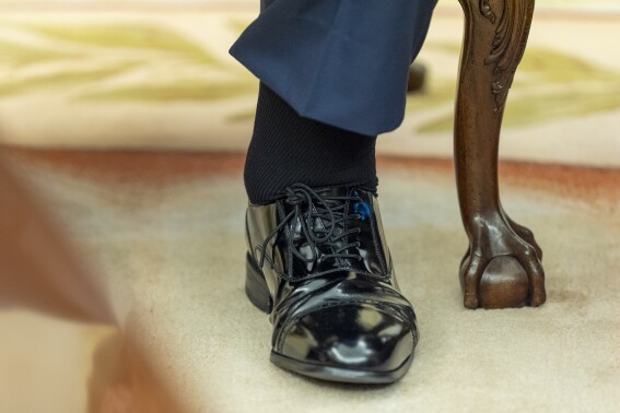 The left foot and swollen ankle of President Donald Trump are pictured as he sits with Bahrain's Crown Prince Salman bin Hamad Al Khalifa in the Oval Office of the White House, Wednesday, July 16, 2025, in Washington. (AP Photo/Alex Brandon)