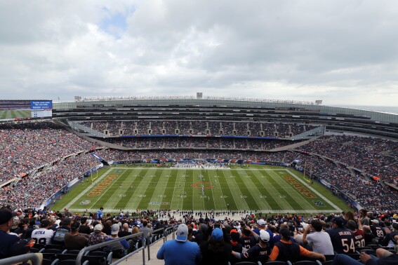 Fans watch an NFL football game between the Chicago Bears and the Detroit Lions, at Soldier Field in Chicago, Oct. 2, 2016. (AP Photo/Kiichiro Sato, File)