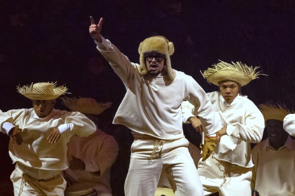 Bad Bunny performs during his first show of his 30-date concert residency at the Coliseo de Puerto Rico José Miguel Agrelot, in San Juan, Puerto Rico, Friday, July 11, 2025. (AP Photo/Alejandro Granadillo)