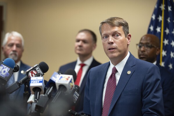 Acting U.S. Attorney Alexander C. Van Hook speaks during a press conference announcing the indictment of current and former police officers on fraud and conspiracy charges, Wednesday, July 16, 2025, at the Lafayette Federal Courthouse in Lafayette, La. (Brad Bowie/The Times-Picayune/The New Orleans Advocate via AP)
