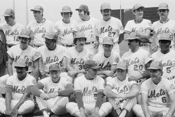 The 1969 New York Mets, pose for a 10th anniversary reunion photo at New York's Shea Stadium Saturday, July 14, 1979. Present at the Old Timers' Day were, top row, from left: Ken Boswell, Ron Taylor; Ron Swoboda, Ed Kranepool, Don Cardwell, Jim McAndrew, and Gary Gentry. Second row: Art Shamsky, Donn Clendenon, Jack DiLauro, J.C. Martin, Tommie Agee and Ed Charles. Third row: Cleon Jones, Joe Pinatano, Rube Walker, Jerry Grote, and Al Weis. (AP Photo/Bob Schutz,File)