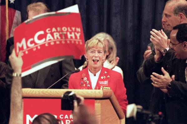 Carolyn McCarthy makes her acceptance speech at Adelphi University in Garden City, N.Y., Nov. 5, 1996, after defeating incumbent Republican congressman Dan Frisa. (AP Photo/Ron Frehm, File)