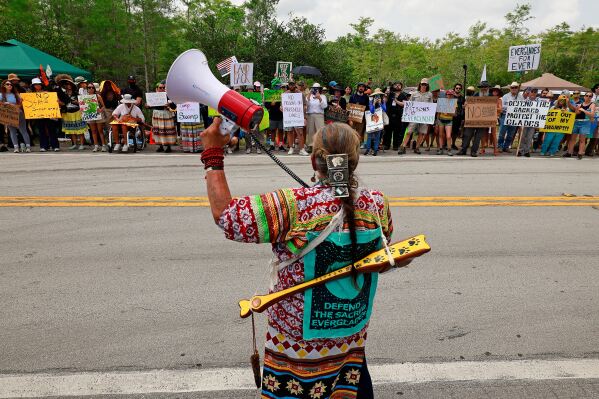 Betty Osceola with the Miccosukee tribe of Indians addresses environmental advocates and other protesters at the Dade-Collier Training and Transition Airport on Tamiami Trail E, Ochopee, Fla.,on Saturday, June 28, 2025. (Mike Stocker /South Florida Sun-Sentinel via AP)