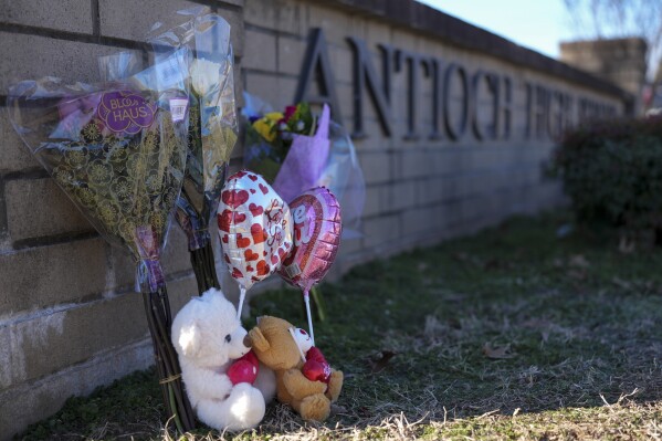 Flowers and stuffed animals are seen at a memorial for victims of a shooting at Antioch High School, Thursday, Jan. 23, 2025, in Nashville, Tenn. (AP Photo/George Walker IV, File)
