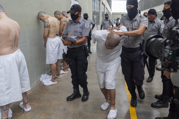 A prisoner is moved as Homeland Security Secretary Kristi Noem tours of the Terrorist Confinement Center in Tecoluca, El Salvador, March 26, 2025. (AP Photo/Alex Brandon, File)