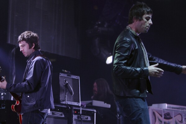 Noel, left, and Liam Gallagher, of Oasis, perform in Vancouver, B.C., on Aug. 27, 2008. (Darryl Dyck/The Canadian Press via AP, File)