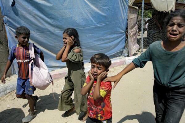 Palestinian children are evacuated from a site hit by an Israeli bombardment on Khan Younis, southern Gaza Strip, Saturday, July 13, 2024. (AP Photo/Jehad Alshrafi)