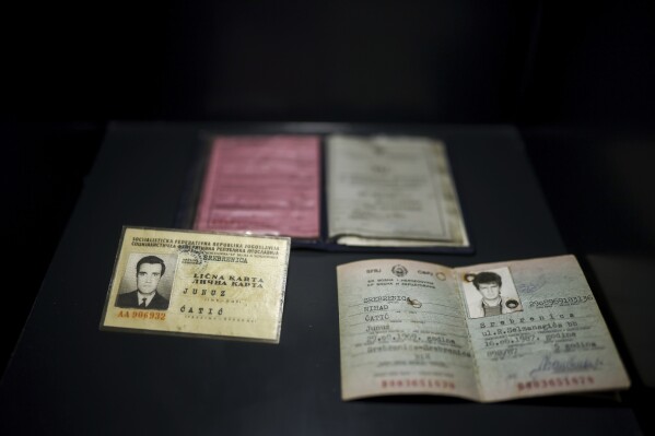 Personal documents found in a mass grave are shown as a part of the exhibition "Lives Beyond the Fields of Death" opened at the Srebrenica Memorial Center in Potocari, Bosnia, Thursday, July 10, 2025. (AP Photo/Armin Durgut)