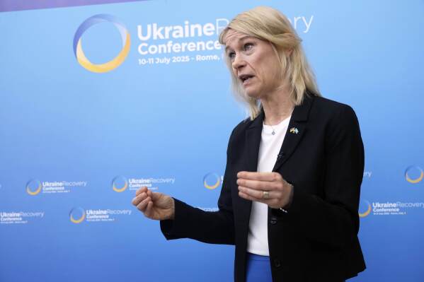 UNHCR Ukraine Representative Karolina Lindholm is interviewed by the Associated Press during the Ukraine Recovery Conference at La Nuvola convention center in Rome, Friday, July 11, 2025. (AP Photo/Gregorio Borgia)