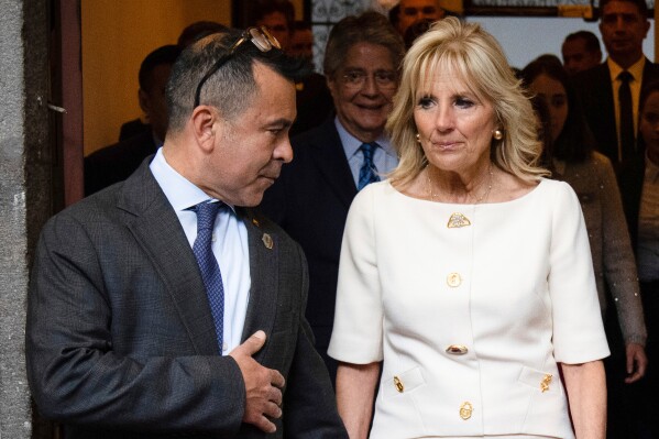 First lady Jill Biden talks with senior adviser Anthony Bernal before her speech at the Carondelet Palace in Quito, Ecuador, May 19, 2022. (Erin Schaff/The New York Times via AP, Pool, File)