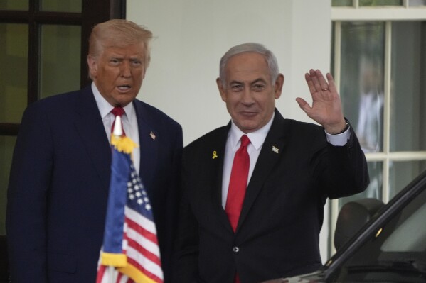 Israel's Prime Minister Benjamin Netanyahu, right, is greeted by President Donald Trump as he arrives at the West Wing of the White House in Washington, April 7, 2025, in Washington. (AP Photo/Mark Schiefelbein, File)