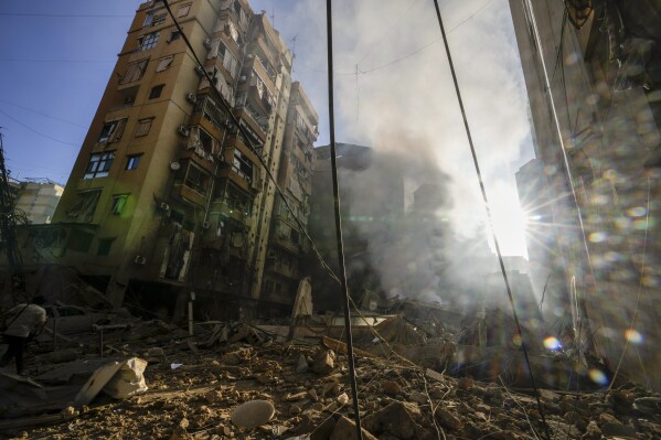 Smoke rises from the site of an Israeli airstrike in Dahiyeh, Beirut, Lebanon, Thursday, Oct. 3, 2024. (AP Photo/Hassan Ammar)