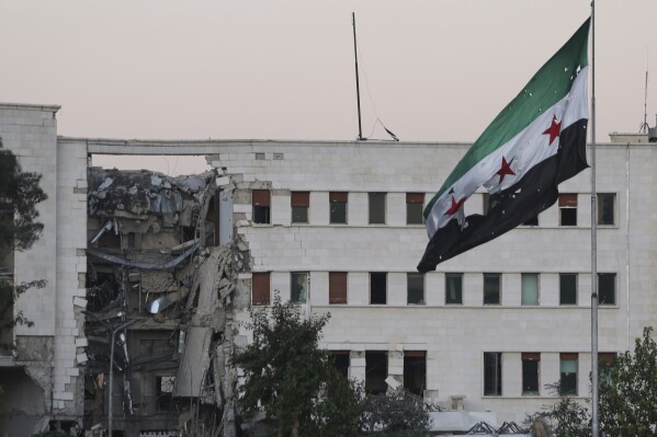 The Syrian Defense Ministry building sits heavily damaged after alleged Israeli airstrikes in Damascus, Syria, Wednesday, July 16, 2025. (AP Photo/Ghaith Alsayed)