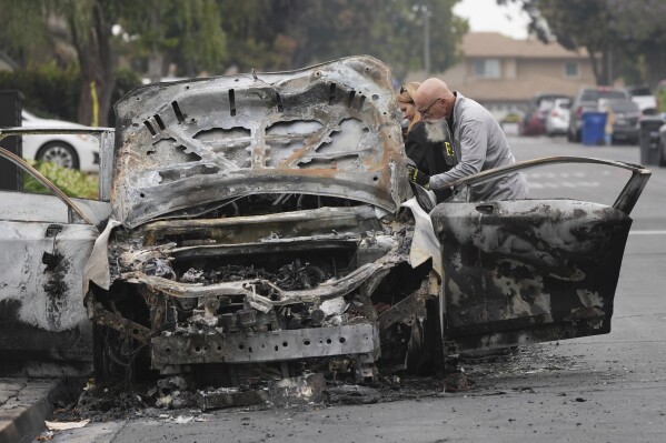 at the site of a plane crash Friday, May 23, 2025, in San Diego. (AP Photo/Gregory Bull)