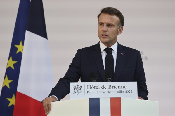 French President Emmanuel Macron speaks to the army leaders at the Hotel le Brienne, Sunday, July 13, 2025, ahead of the Bastille Day parade in Paris. (Ludovic Marin, Pool Photo via AP)