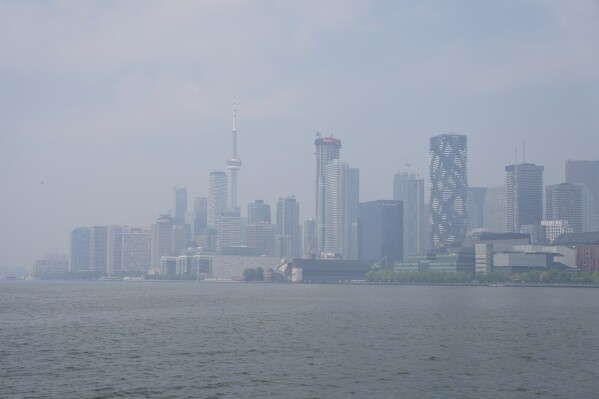 A city view of Toronto on Monday July 14, 2025. The Air Quality Health Index rating for Toronto was over 10, or "very high risk," from wildfire smoke on Monday morning. (Chris Young/The Canadian Press via AP)
