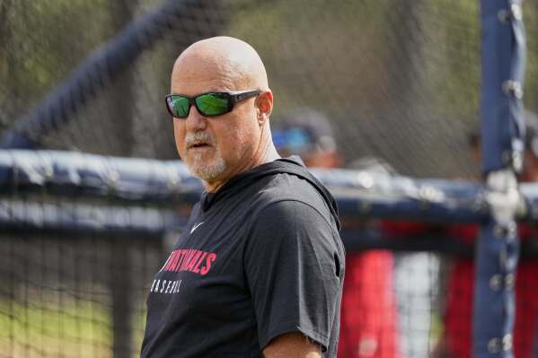 Washington Nationals general manager Mike Rizzo watches during a spring training baseball practice Tuesday, Feb. 18, 2025, in West Palm Beach, Fla. (AP Photo/Jeff Roberson, File)