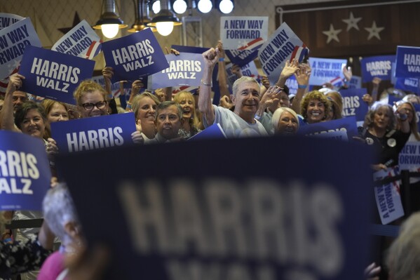 Supporters of Democratic presidential nominee Vice President Kamala Harris await the arrival of second gentleman Doug Emhoff, at a campaign event in The Villages, Fla., Friday, Sept. 13, 2024. (AP Photo/Rebecca Blackwell)
